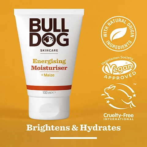 Image 2 - A white tube of Bulldog Skincare Energising Moisturiser with a yellow background, featuring the text BULLDOG SKINCARE Energising Moisturiser + Maize 100 ml and icons for With Natural Origin Ingredients, Vegan Approved, and Cruelty-Free International, along with the phrase Brightens & Hydrates.
Image 3 - An arrangement of corn kernels on a bright yellow background with the text 95% Natural Origin, Unlock the true potential of natural origin ingredients, and Maize.
Image 4 - A hand holding a tube of Bulldog Skincare Energising Moisturiser with visible text that reads Dull & Tired Skin.
Image 5 - A white tube of Bulldog Skincare Energising Moisturiser featuring visible text BULL DOG, Energising Moisturiser + Maize, Brightens & Hydrates, 95% Natural Origin, and Recycled Tube, with notes about the tubes materials.
Image 6 - Three skincare products from Bulldog are displayed on a bright orange background, including an Energising Face Scrub, Energising Face Wash, and Energising Moisturiser, with the text Revitalise Dull & Tired Skin prominently featured at the bottom.
