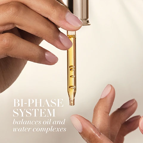 Image 1 - A hand holding a dropper with a golden liquid above another hand, with visible text saying BI-PHASE SYSTEM balances oil and water complexes.
Image 2 - A close-up of a woman’s face highlighting her skin texture and freckles, with the words ABSORBS Instantly displayed prominently.
Image 3 - A close-up image of golden oil droplets floating in liquid with the text Infinity Oil Complex at the top and a list of oils including Cranberry Oil, Olive Oil, Camelina Oil, Rapeseed Oil, Sweet Almond Oil, Jojoba Oil, Meadowfoam Oil, and Sea Buckthorn Oil below.
Image 4 - A close-up image of a blue-green background featuring translucent bubbles with bright reflections, accompanied by the text Marine and Peptide Powered and Hydro Fusion Complex.